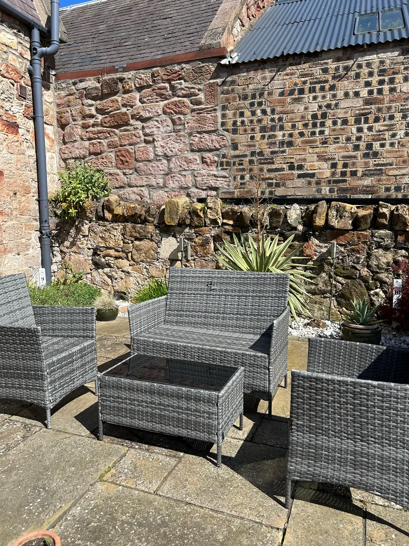 Private patio with table, chairs and outdoor heater