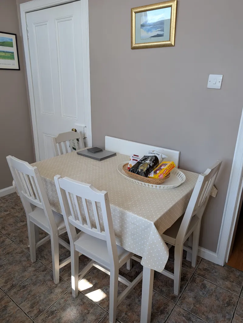 Kitchen with dining table and four chairs