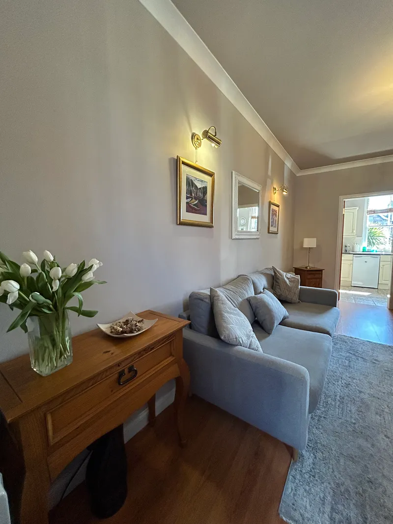 Living room with sofa seating and smart TV