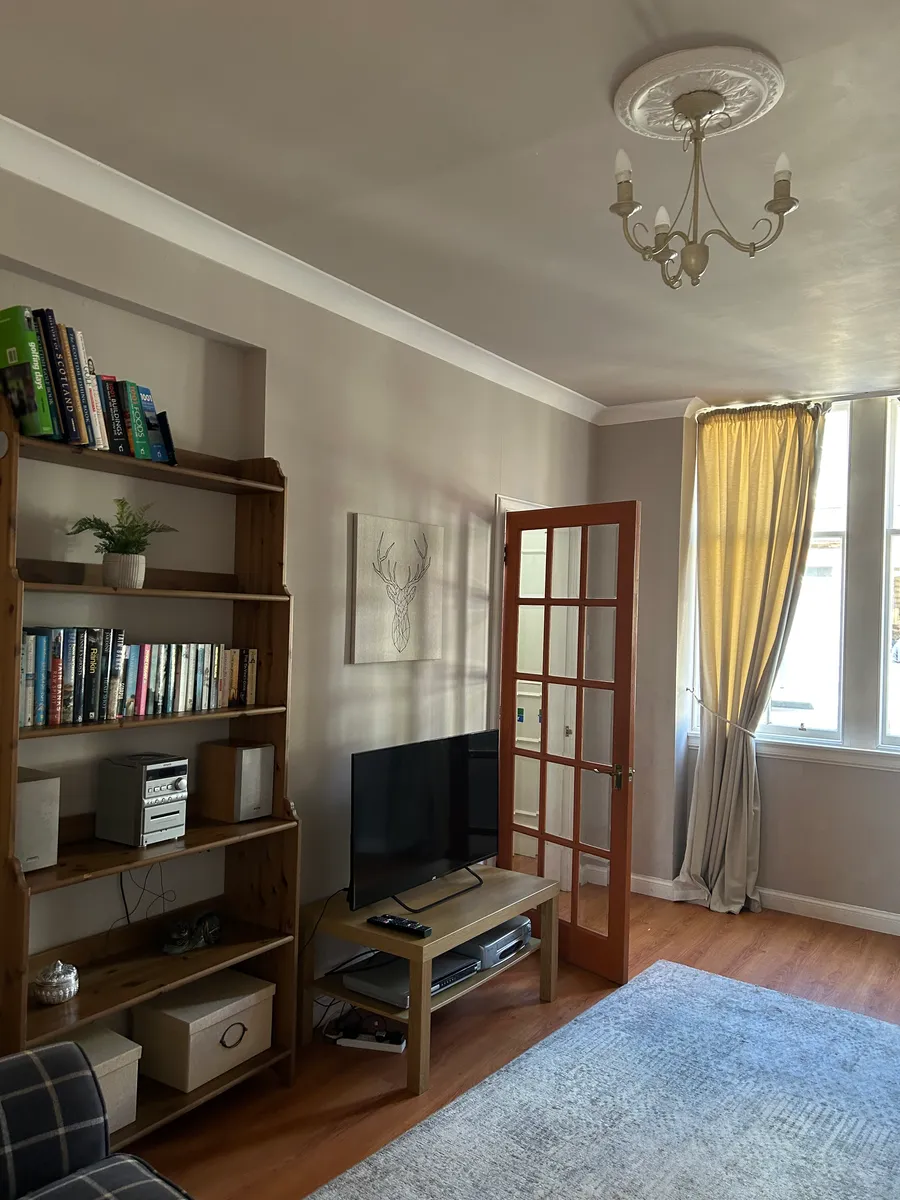 Living room with seating area and smart TV